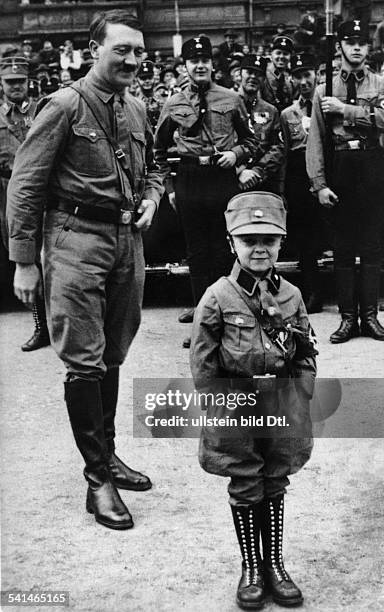 Germany, Weimar Republic National socialist movement Adolf Hitler *20.04.1889-+ Politician, Nazi Party, Germany Hitler with a small boy in SA-uniform...