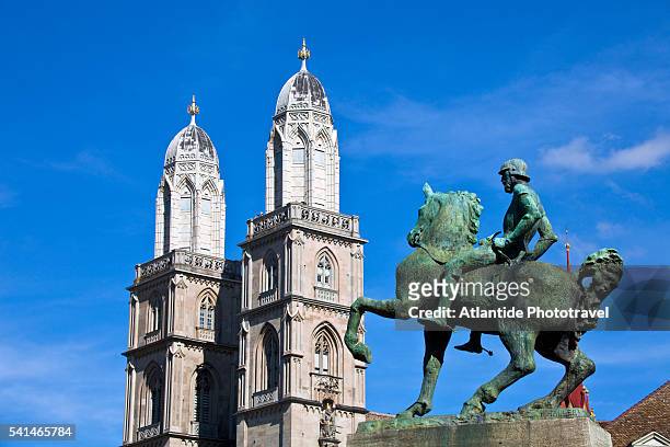 equestrian statue of hans waldmann and the towers of grossmunster, zurich, switzerland - grossmunster cathedral stock pictures, royalty-free photos & images