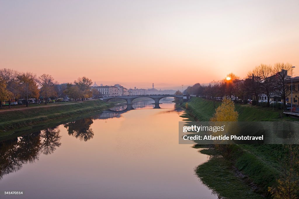 The river Arno, the Ponte della Vittoria and the town from Cascine park, Florence, Italy