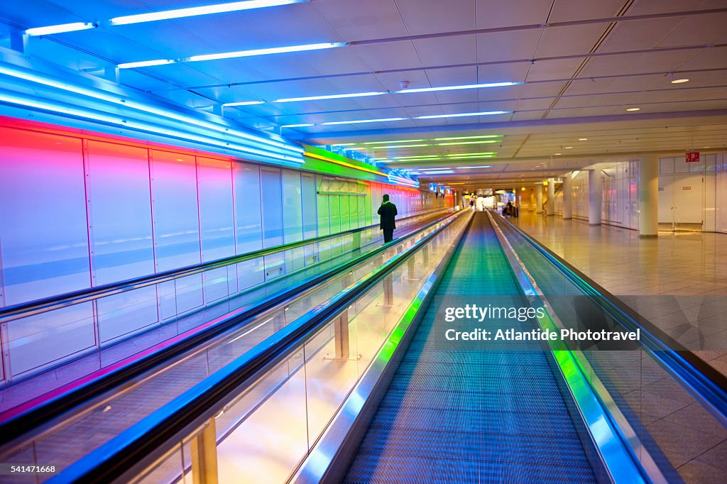 Man on moving walkway at Munich airport