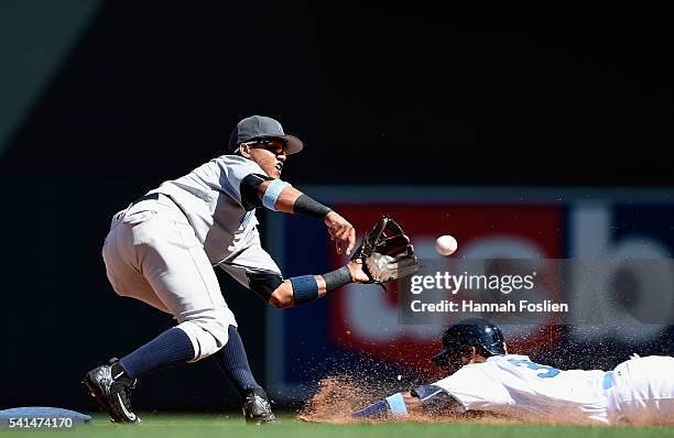 Starlin Castro of the New York Yankees catches Danny Santana of the Minnesota Twins stealing second base during the eighth inning of the game on June...