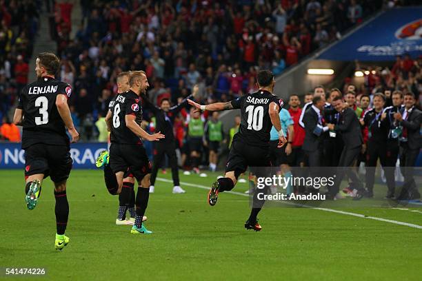 Players of Albania celebrate after scoring a goal during the UEFA EURO 2016 Group A match between Romania and Albania at Stade de Lyon in Lyon,...