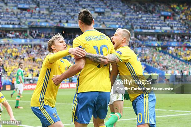 Emil Forsberg, Zlatan Ibrahimovic and John Guidetti of Sweden celebrate after Republic of Ireland scored an own goal to make 1-1 during the UEFA EURO...