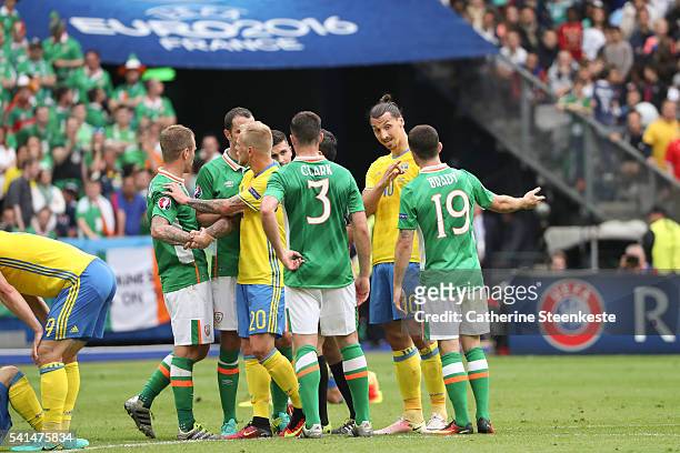 Zlatan Ibrahimovic of Sweden and Robbie Brady of Republic of Ireland react to a play during the UEFA EURO 2016 Group E match between Republic of...