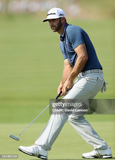 Dustin Johnson of the United States watches a putt on the seventh green during the final round of the U.S. Open at Oakmont Country Club on June 19,...