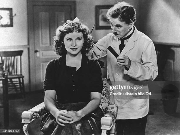 Chaplin, Charlie - Actor, film director, Great Britain - *16.04.1889-+ Scene from the movie 'The Great Dictator' as Jewish barber with Paulette...