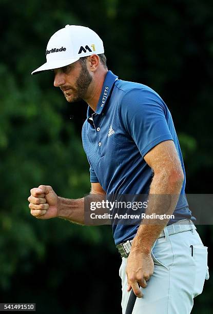 Dustin Johnson of the United States celebrates a par save on the 16th green during the final round of the U.S. Open at Oakmont Country Club on June...