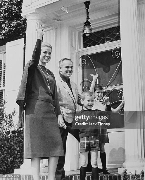 From the steps of her childhood home, Princess Grace of Monaco waves with her family, from second left, her husband Rainier III, Prince of Monaco ,...