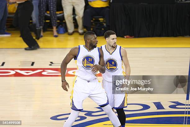 Festus Ezeli and Klay Thompson of the Golden State Warriors after a play against the Cleveland Cavaliers during Game Seven of the 2016 NBA Finals on...