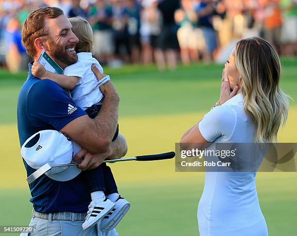 Dustin Johnson of the United States celebrates with partner Paulina Gretzky and son Tatum after winning the U.S. Open at Oakmont Country Club on June...