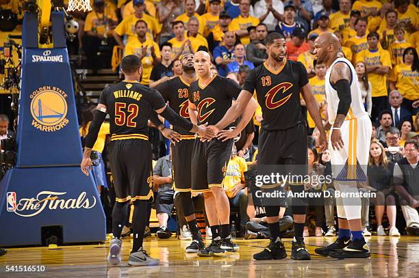 Mo Williams of the Cleveland Cavaliers shakes hands with Tristan Thompson of the Cleveland Cavaliers during the game against the Golden State...