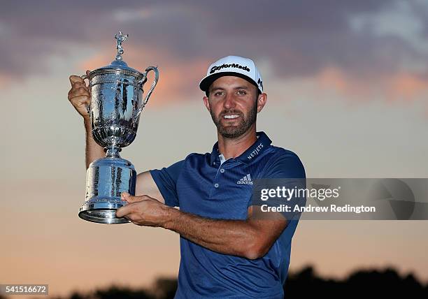 Dustin Johnson of the United States poses with the winner's trophy after winning the U.S. Open at Oakmont Country Club on June 19, 2016 in Oakmont,...