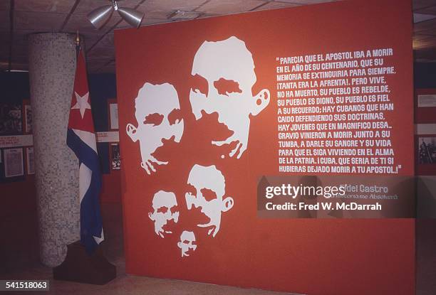 View of a Cuban history display inside Jose Marti International Airport, Havana, Cuba, January 26, 1983. A large poster includes images of, and a...