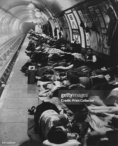 Those who went to shelters began a new kind of night-life, 11th November, 1940', 1942. London residents taking shelter in Elephant and Castle tube...