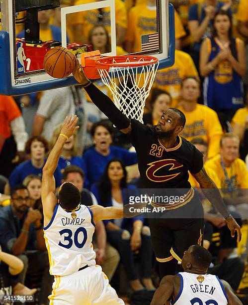 Cleveland Cavaliers forward LeBron James blocks a shot attempt by Golden State Warriors guard Stephen Curry during the second quarter in Game 7 of...