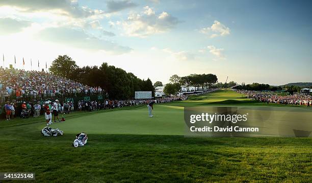 Dustin Johnson of the United States celebrates his birdie putt on the 18th green during the final round of the U.S. Open at Oakmont Country Club on...