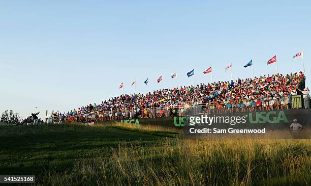 Dustin Johnson of the United States hits his tee shot on the 18th hole during the final round of the U.S. Open at Oakmont Country Club on June 19,...