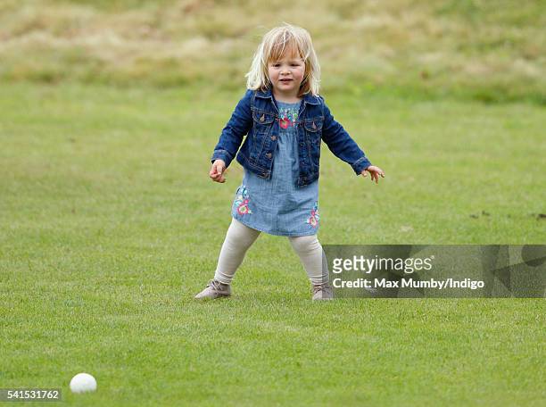 Mia Tindall watches her mother Zara Phillips play in a Jockeys vs Olympians charity polo match at the Beaufort Polo Club on June 19, 2016 in Tetbury,...
