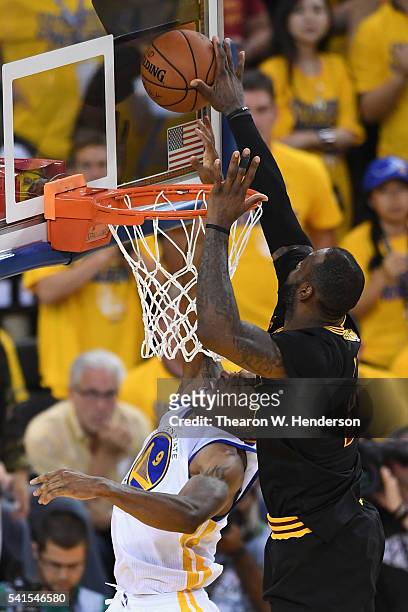 LeBron James of the Cleveland Cavaliers blocks a shot by Andre Iguodala of the Golden State Warriors in Game 7 of the 2016 NBA Finals at ORACLE Arena...