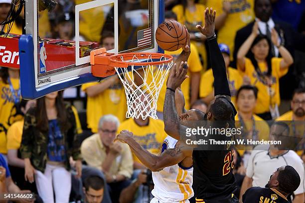 LeBron James of the Cleveland Cavaliers blocks a shot by Andre Iguodala of the Golden State Warriors in Game 7 of the 2016 NBA Finals at ORACLE Arena...