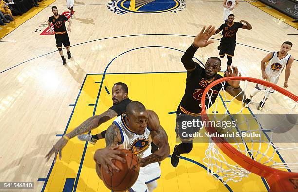 LeBron James of the Cleveland Cavaliers blocks a shot by Andre Iguodala of the Golden State Warriors in Game Seven of the 2016 NBA Finals on June 19,...