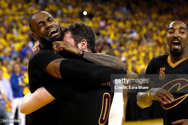 LeBron James and Kevin Love of the Cleveland Cavaliers celebrate after defeating the Golden State Warriors 93-89 in Game 7 of the 2016 NBA Finals at...