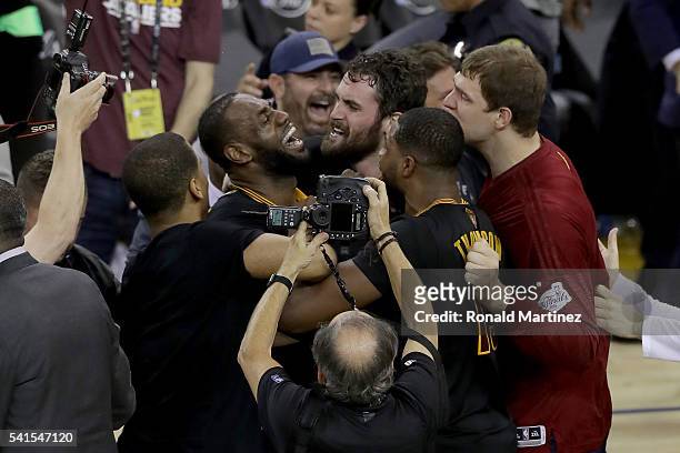 LeBron James and Kevin Love and the Cleveland Cavaliers celebrate after defeating the Golden State Warriors 93-89 in Game 7 of the 2016 NBA Finals at...