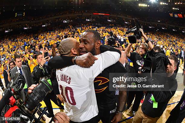 LeBron James and Dahntay Jones of the Cleveland Cavaliers hug after winning the NBA Championship against the Golden State Warriors during the 2016...