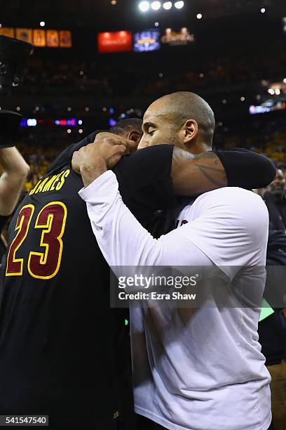 LeBron James and Dahntay Jones of the Cleveland Cavaliers celebrate after defeating the Golden State Warriors 93-89 in Game 7 of the 2016 NBA Finals...