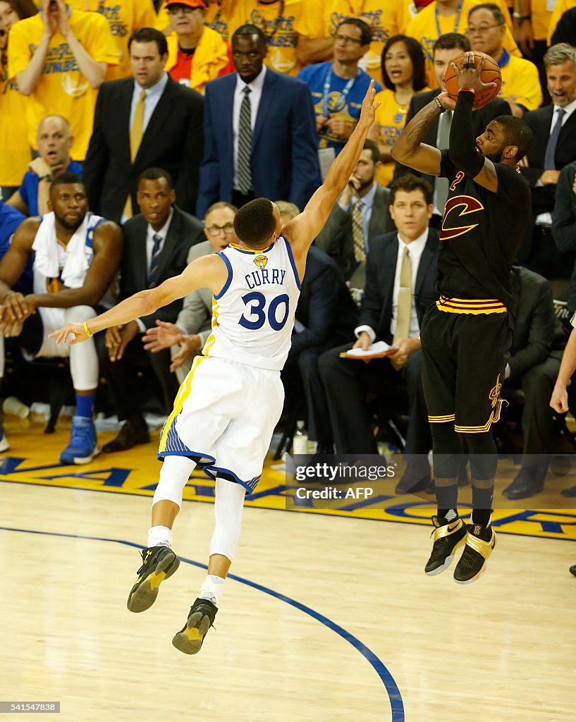 Cleveland Cavaliers guard Kyrie Irving makes a three-point shot
