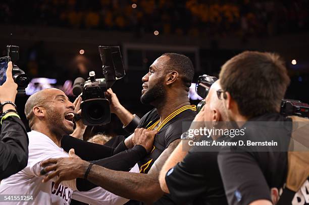 LeBron James of the Cleveland Cavaliers and Dahntay Jones of the Cleveland Cavaliers celebrate after winning Game Seven of the 2016 NBA Finals...