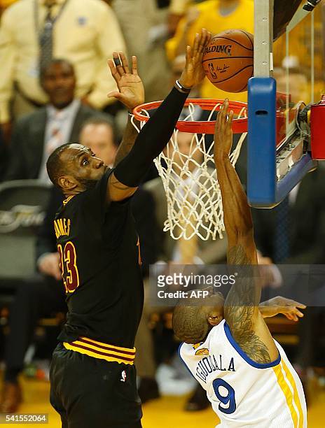 Cleveland Cavaliers forward LeBron James blocks a shot by Golden State Warriors Andre Iguodala during the fourth quarter in Game 7 of the NBA Finals...