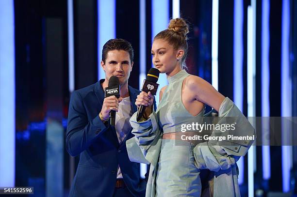 Robbie Amell and Gigi Hadid present at the 2016 iHeartRADIO MuchMusic Video Awards at MuchMusic HQ on June 19, 2016 in Toronto, Canada.