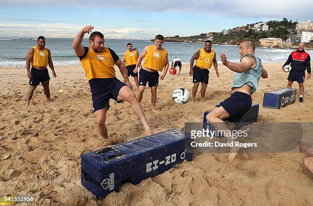 Matt Mullan and Mike Brown contest the ball during the England recovery session held at Coogee Beach on June 20, 2016 in Sydney, Australia.