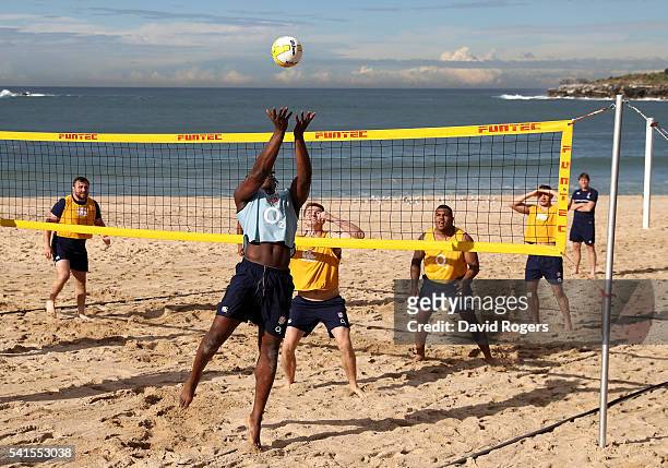 Maro Itoje smashes the ball during a game of beach volleyball during the England recovery session held at Coogee Beach on June 20, 2016 in Sydney,...