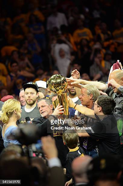 Cleveland Cavaliers owner Dan Gilbert poses with the Larry O'Brien NBA Championship Trophy after defeating the Golden State Warriors in Game Seven of...