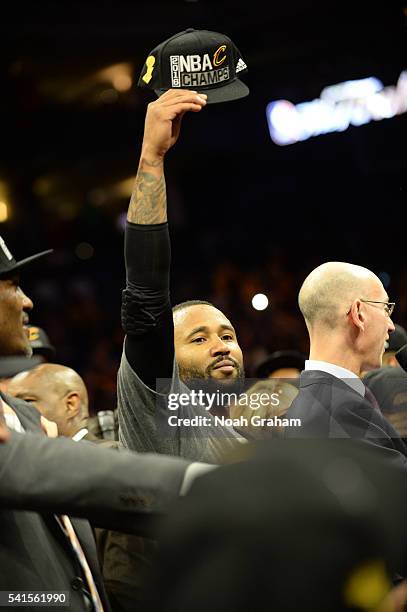 Mo Williams of the Cleveland Cavaliers celebrating with the Larry O'Brien NBA Championship Trophy after defeating the Golden State Warriors in Game...