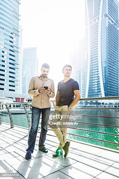 two friends in the city - only young men stock pictures, royalty-free photos & images