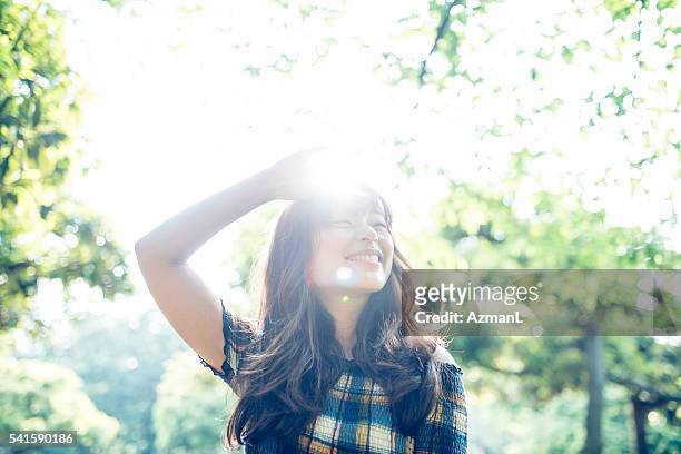 fun under the sun - one young woman only photos stockfoto's en -beelden