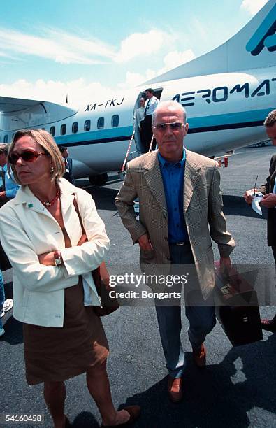 Franz Beckenbauer and his partner Sybille Beckenbauer arrive at the Airport on July 25, 1990 in Guadalajara, Mexico.