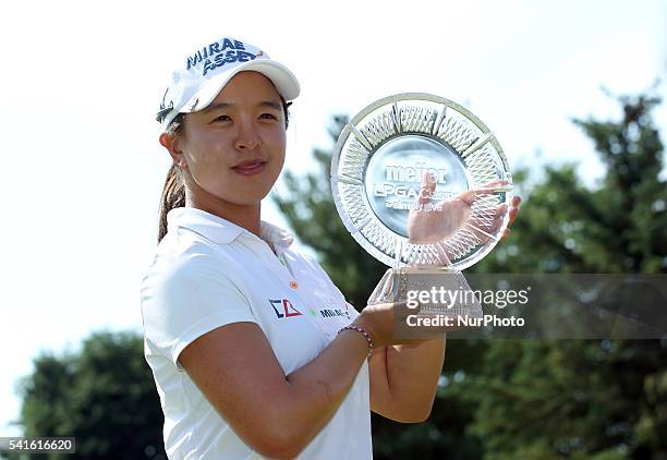 Sei Young Kim of Seoul holds up the trophy after winning the final round by playoff of the Meijer LPGA Classic golf tournament at Blythefield Country...
