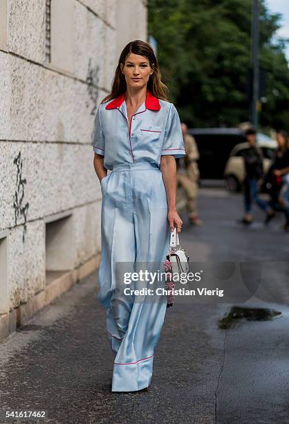 Hanneli Mustaparta wearing a babyblue Prada pyjama and white bag outside Prada during the Milan Men's Fashion Week Spring/Summer 2017 on June 19,...