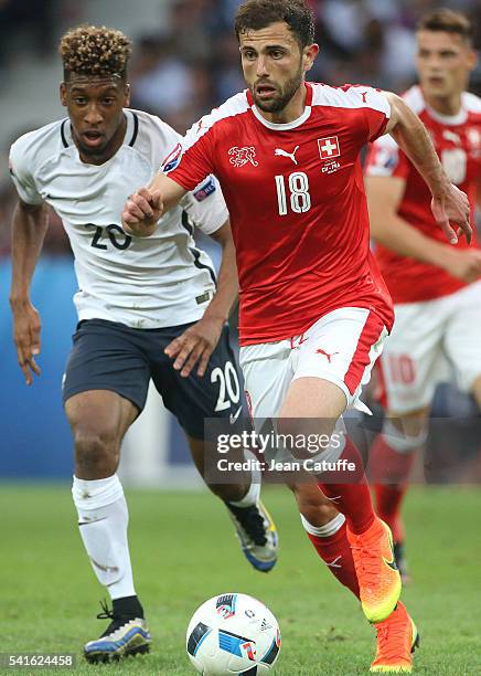 Admir Mehmedi of Switzerland and Kingsley Coman of France in action during the UEFA EURO 2016 Group A match between Switzerland and France at Stade...