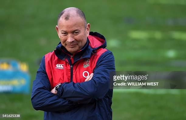 England rugby coach Eddie Jones watches his players train in Sydney on June 20 after England defeated the Australian Wallabies in the second Test to...