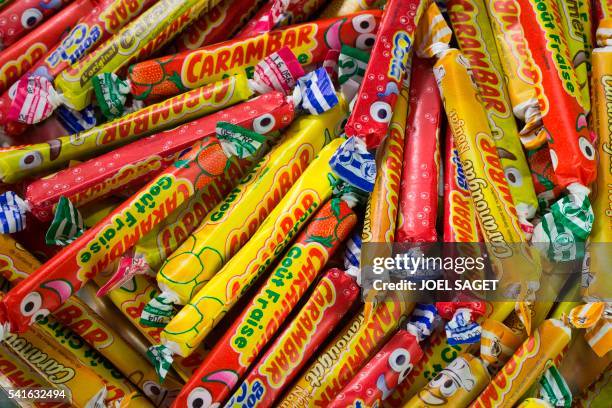 Chewy natural flavours candies of the Carambar brand are pictured on June 17, 2016 in Paris. - A handful of French companies is targetting...