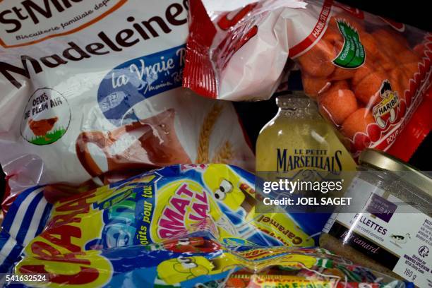 Madeleine shell-shaped cookies, Carambar chewy candies, strawberry Tagada candies, traditional Petit Marseillais soap and rillettes are pictured on...