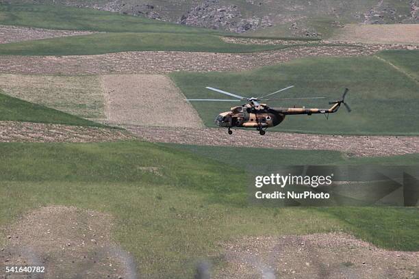 Afghan National Army helicopters are flying in the mountainous region of Badakhshan in northeast Afghanistan on 15 June 2106.