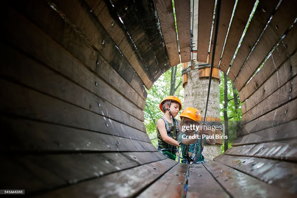 Two boys playing in adventure park