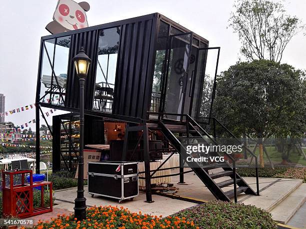 Small bar is built in slanted shipping container on June 19, 2016 in Chengdu, Sichuan province of China. The bar is elevated from the ground and...