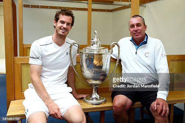 Andy Murray of Great Britain and his coach Ivan Lendl pose with the Aegon Championships trophy after winning his record breaking fifth title with...